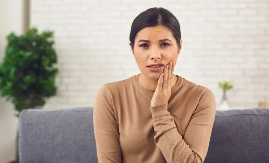 Woman Holding Face With Tooth Pain