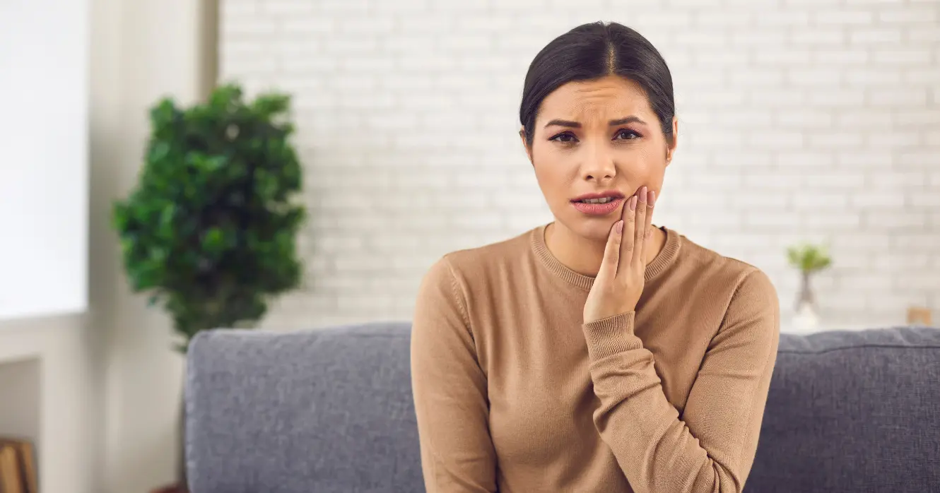 Woman Holding Face With Tooth Pain