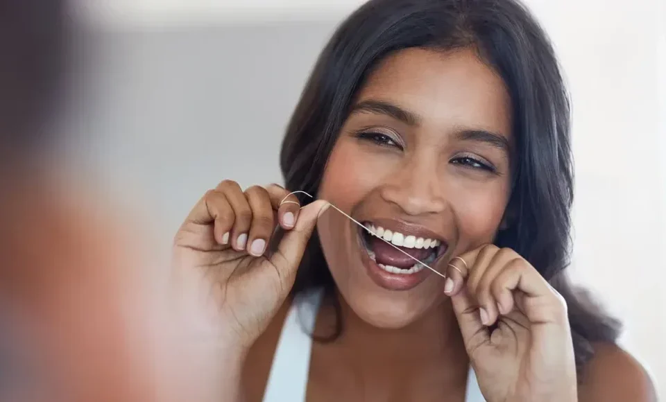 Woman Flossing