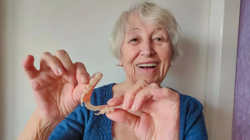 Lady smiling with dentures